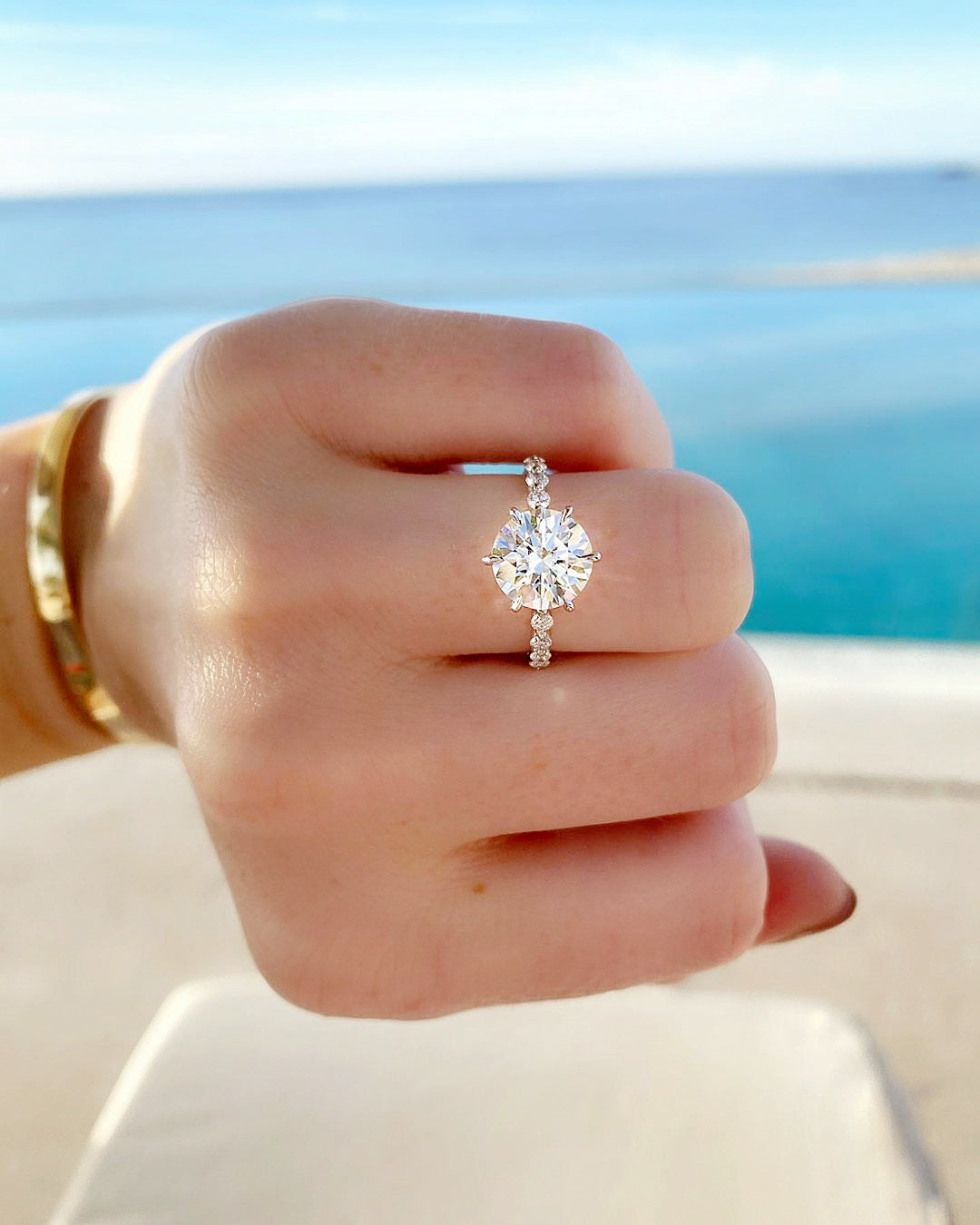 The Loire - Round Cut Moissanite 6 Claw Prong Solitaire Pavé Ring with 1 to 3 carats in 18K White, Yellow or Rose Gold